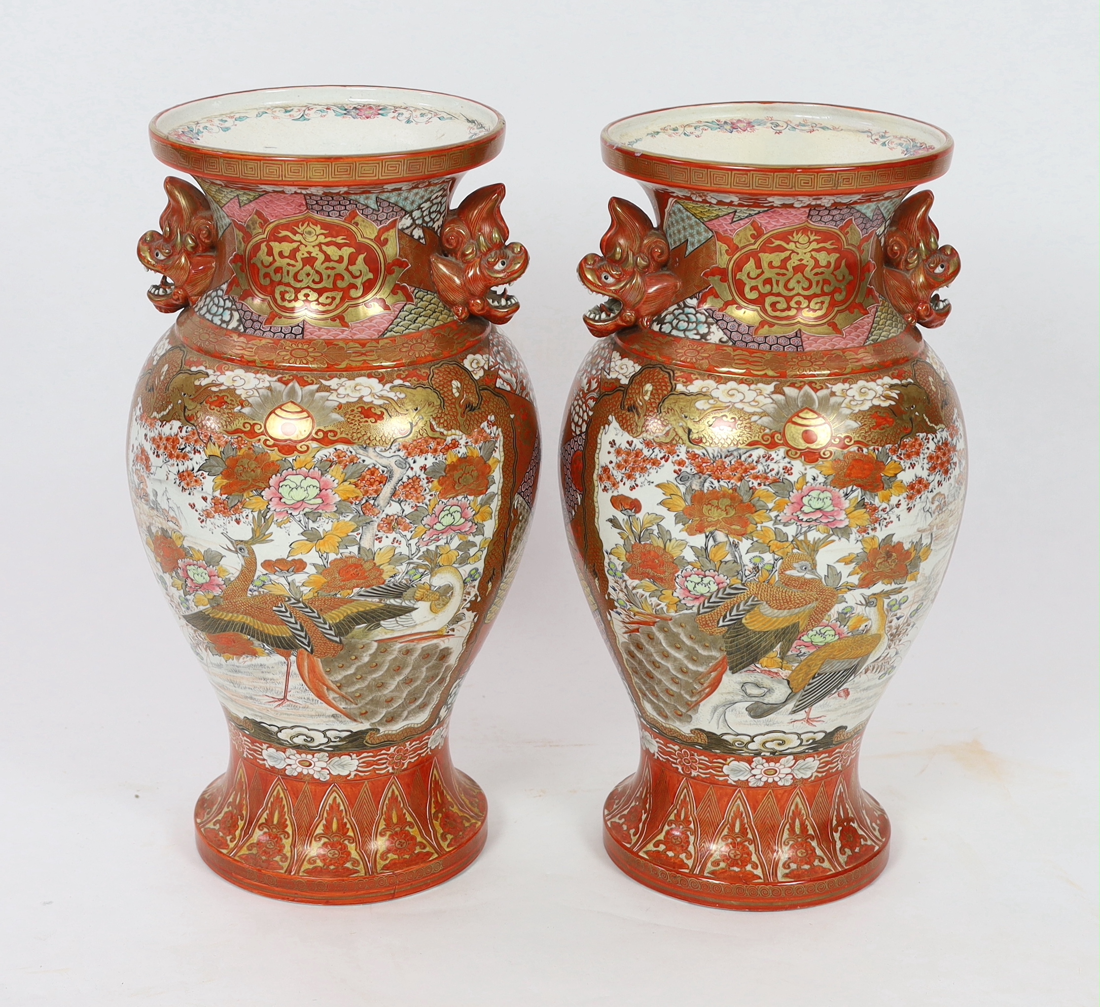 A pair of massive Japanese Kutani vases, Meiji period, one neck restored